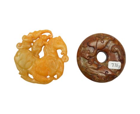 A Chinese russet and green jade bi disc and another plaque, largest 7cm diameter. Condition - good