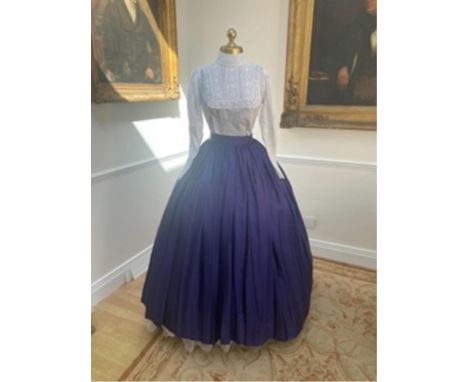 A Victorian style full skirt in peacock blue taffeta with white blouse and lace trim. Size Small/Medium.