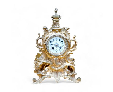 A late 19th century gilt bronze rococo style mantel clock, with pendulum, 38cm tall. Condition - fair, not tested