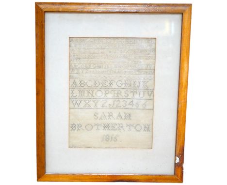 A George III needlework sampler, by Sarah Brotherton, dated 1815, a simple graduated monochrome alphabet sampler, the top wor