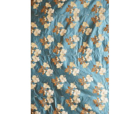 A turquoise satin floral silk brocaded panel of four 59cm widths, boldly embroidered in yellow and brown strays of lilies, th