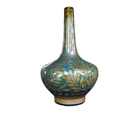 A Pilkington’s Royal Lancastrian lustre bottle vase by William S Mycock, decorated with foliage, 22cm high. Condition - good.