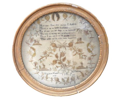 An unusual charming circular gilt framed sampler, by Elizabeth Hughes, aged 11 years, dated 1795, worked in fine wools with a