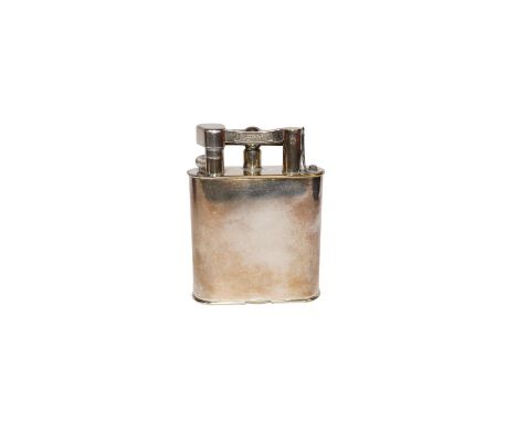 An engraved Alfred Dunhill plated table lighter, 10.7cm. Condition - fair, general wear to the plate