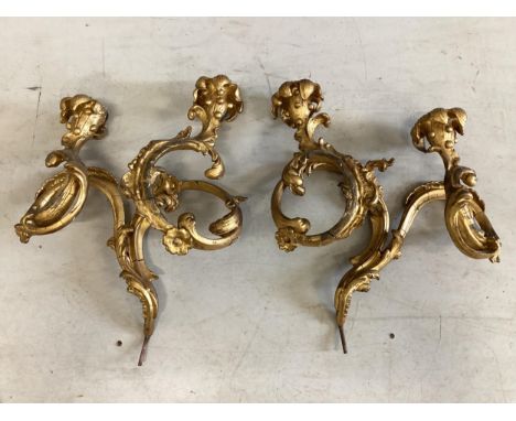 A pair of Victorian giltwood and composition twin branch wall lights (from a girandole), height 42cm. Condition - fair