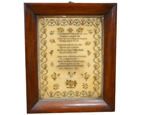 A wide mahogany framed sampler by Ann Whitehouse dated 1834, worked in coloured silks on a fine linen ground, in small stitch