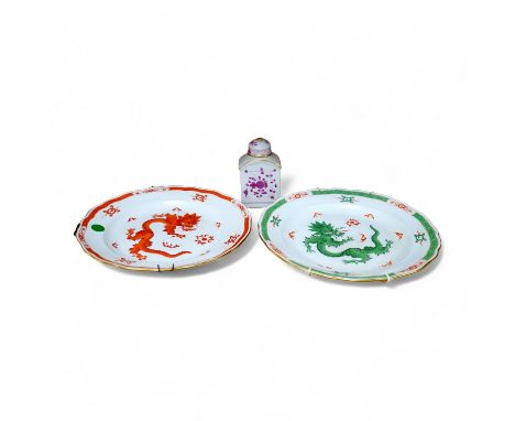 A Meissen dish, painted with a green dragon, 25.5cm diameter, another painted with an iron red dragon and a tea caddy (3). Co