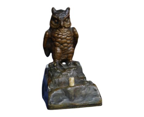 An Austrian cold painted bronze bellpush modelled as a perched owl, 7.5cm high. Condition - fair.