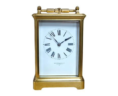 A brass cased repeating carriage clock, retailed by Edwards &amp; Sons Ltd., no key, 15cm. Condition - fair to good, not test