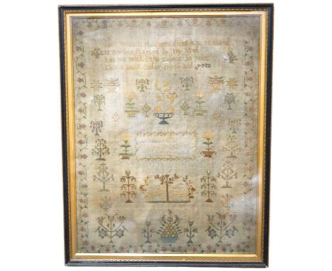 A sampler with spot motifs and central cartouche, embroidered with Ann Richardson, her work aged 14 years 1824. A very finely