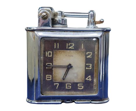 A Lancel Automatique table lighter incorporating an eight day timepiece, 9.5cm high. Condition - fair, some discolouration to