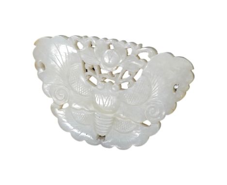 A Chinese reticulated jade ‘butterfly’ plaque , late Qing dynasty, 7cm wide. Condition - good