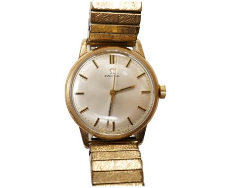 A gentleman's yellow metal Omega manual wind wrist watch, with baton numerals, case diameter 34mm, on an associated rolled go
