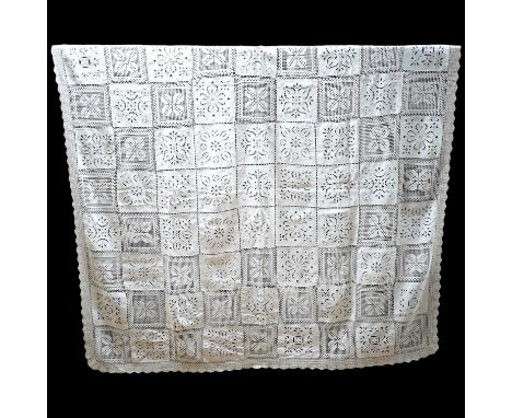 A fancy crochet and anglaise hand worked tablecloth, together with a collection of lawn and linen table linen, mats, etc. and