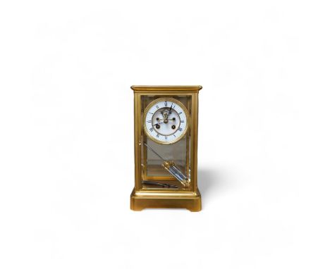 A late 19th century French gilt brass four glass clock, with visible Brocot escapement, key and pendulum, 29.5cm tall. Condit