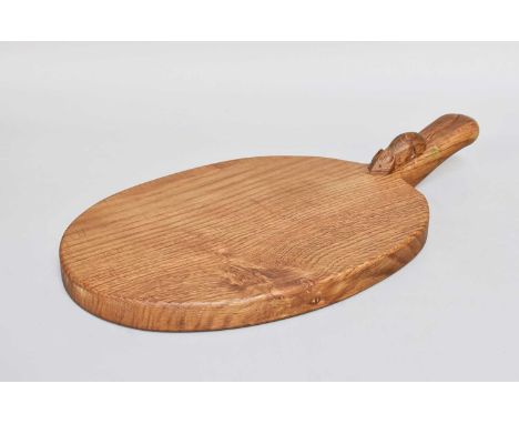 Workshop of Robert Mouseman Thompson (Kilburn): An English Oak Cheese Board, post 1960, of standard form, with carved mouse t