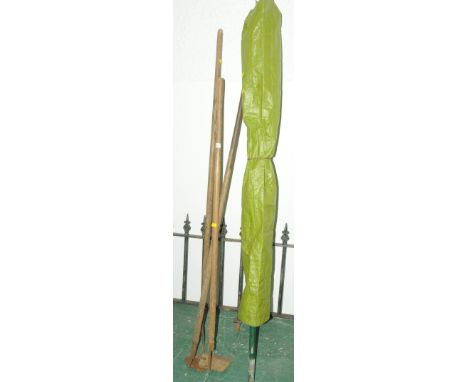Three metal and wooden vintage tools