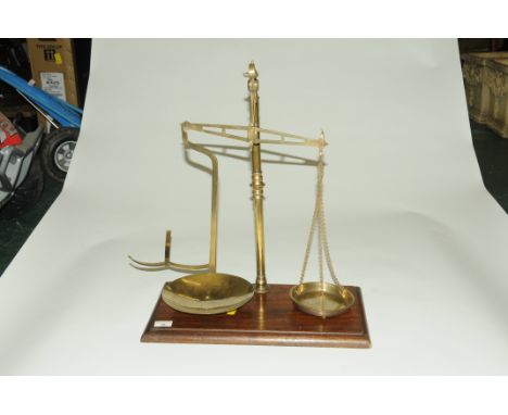 Brass balance scales on oak base