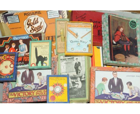 Box of vintage jigsaws and games, to include The Victory and Tuck's puzzles 