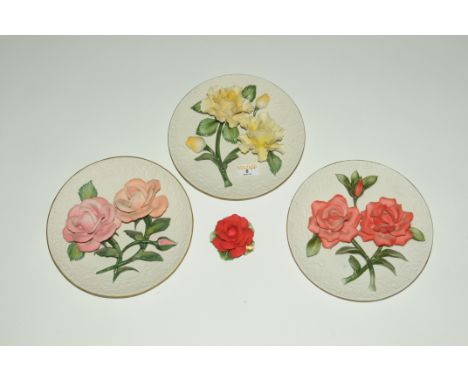 Three floral encrusted ceramic plates and Capodimonte ornamental rose 