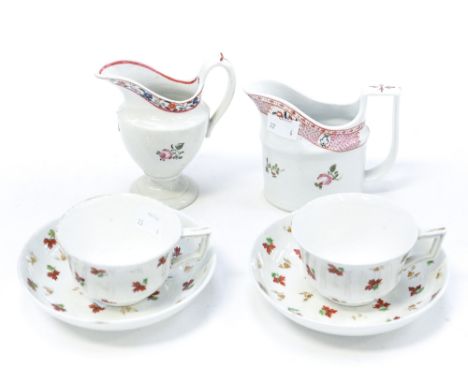 A pair of Derby saucer (mid 19th Century) bowls and cups, red sprig flower design and two hard paste 18th Century style milk 