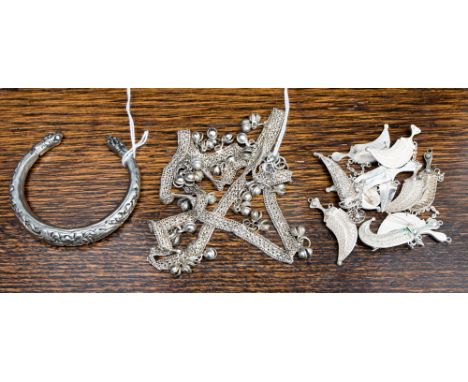 A group of Eastern white metal jewellery to include serpentine bangle (qty)