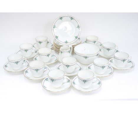 A Shelley Art Nouveau style tea set for twelve, including cups, saucers, plates, sugar and milk jug, decorated with chain and