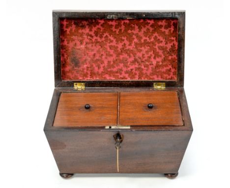 A mid 19th Century mahogany tea caddy, of sarcophagus form, the interior with two compartments