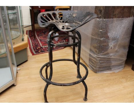 A pair of Pan & Botany cast tractor seats, converted to stools (2)