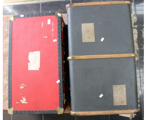 A brown travel trunk with a red travel trunk (2) 
