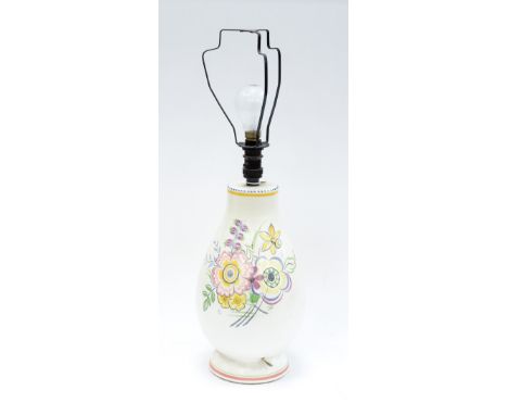  A Poole Pottery lamp base, circa 1930, of footed baluster form, decorated with pastel floral sprays, impressed mark and numb