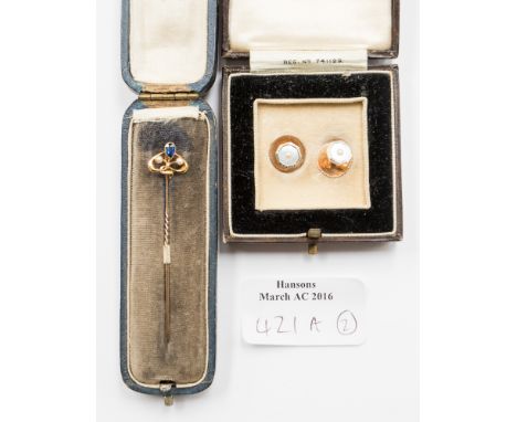 An Edwardian stick pin set with sapphire and seeds pearls in yellow metal marked 15ct gross weight approx 1.3g together with 