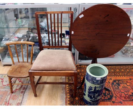 A 19th Century mahogany tilt-top tripod table, the single plank circular top raised on a baluster turned column, standing on 
