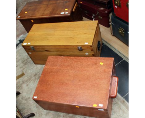 Three various lidded trunks, comprising walnut veneered trunk, a golden oak lidded trunk, together with a further trunk, (3)