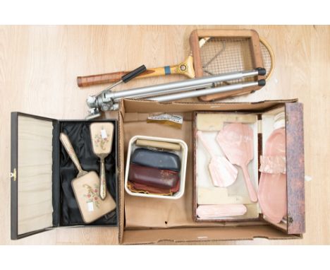 A boxed pink plastic dressing table set 1950s, another gilt metal set, tennis racket, camera tripod, vintage glasses (one box