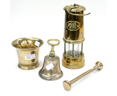 A bell metal pestle and mortar, a school/shop bell and a miner's lamp (3) 