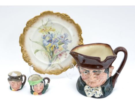 A Royal Doulton hand painted floral cabinet plate, with a Royal Doulton toby jug, and two miniature Royal Doulton toby jugs (