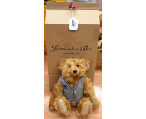 A boxed Steiff limited edition 'Century' Teddy bear modelled on a 1904 example, reddish blonde mohair, no. 1921/9777, model n