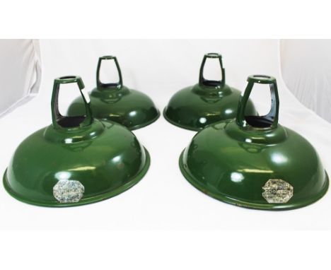 A set of four Coolicon green enamelled light shades