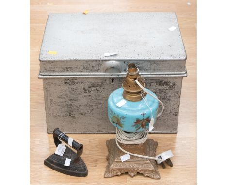 A deed box, metal, a cast iron based oil lamp and a flat iron (3) 