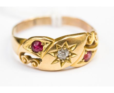 A ruby and diamond ring on gold band 