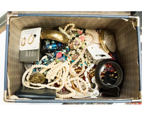 A dressing case containing a good quantity of vintage costume jewellery to include glass and hardstone bead necklaces, compac