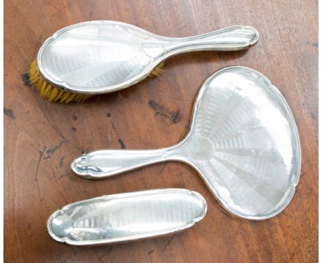 A silver engine turned three piece dressing table set (3) 