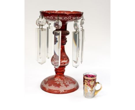 A coated ruby glass lustre with etched out deer and tree design, continental and an Italian enamelled glass with handle, coat