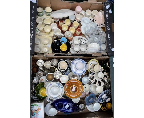 Two boxes of egg cups, including blue glass double egg cup in the form of a hen, sets of egg cup stands, some with condiment 