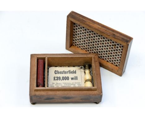 A small desk wax stamp box, containing a stick of wax and an ivory stamp seal