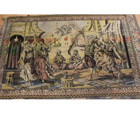 Tapestry rug in a colourway of muted shades, in a Middle Eastern scene portraying men in Arab dress, could be 1920s 