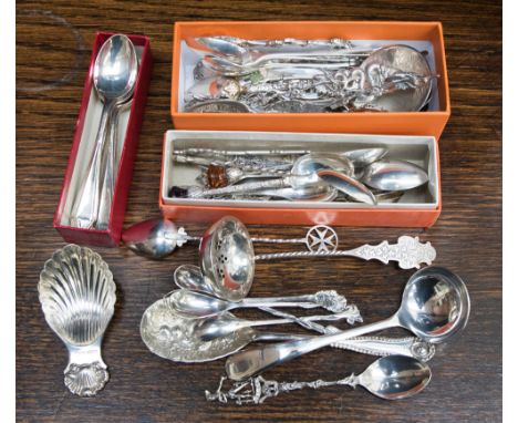 A silver scallop bowl caddy spoon, Birmingham 1969, set of five continental spoons with flower finials together with a collec