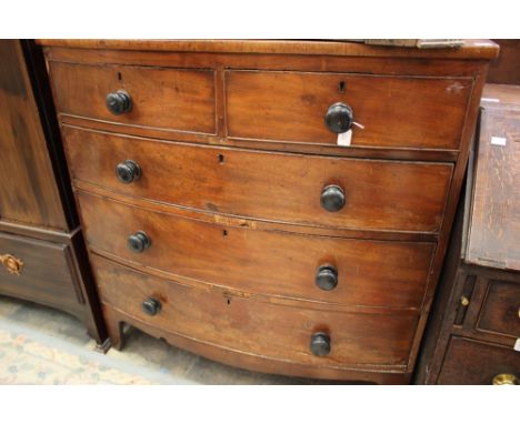 A George III mahogany chest of drawers, bow fronted form, fitted with two short over three long graduated drawers, bracket fe