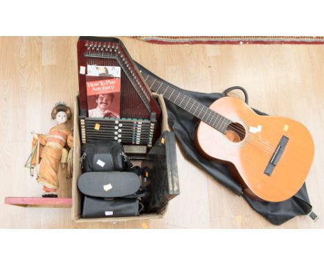 Two cased binoculars with a cased Chinon camera, an Autoharp and a B.M cased Spanish Guitar and a costume doll 